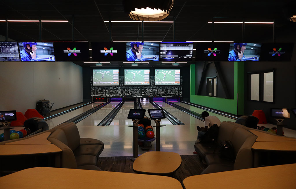 In the Algonquin College Wolves Den Bowling Alley, showing off the bowling lanes 