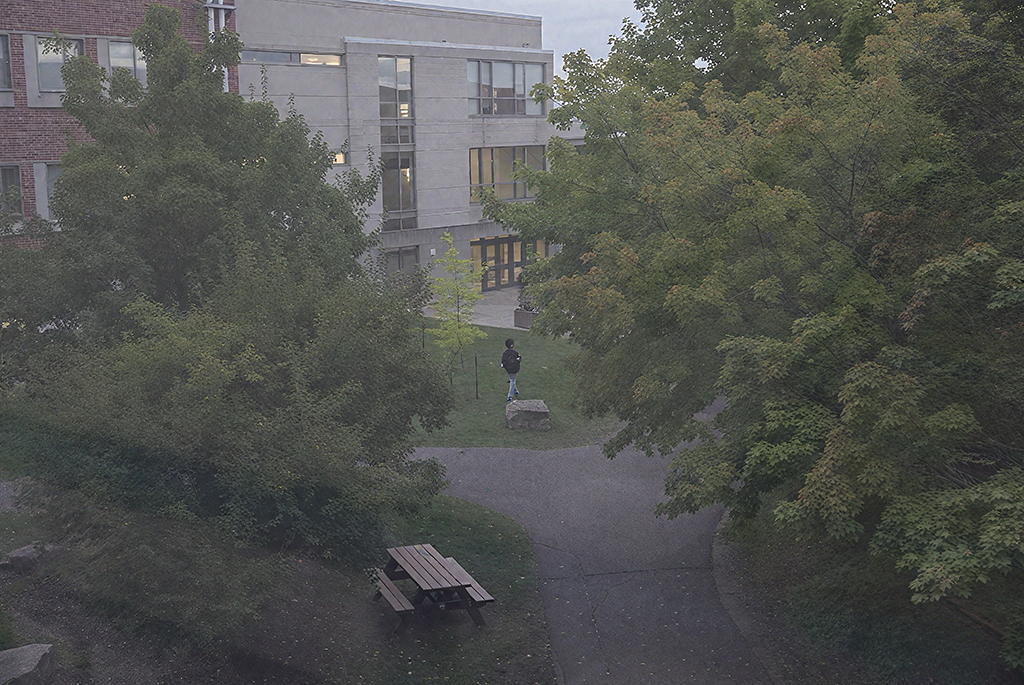 A student walking in the campus.